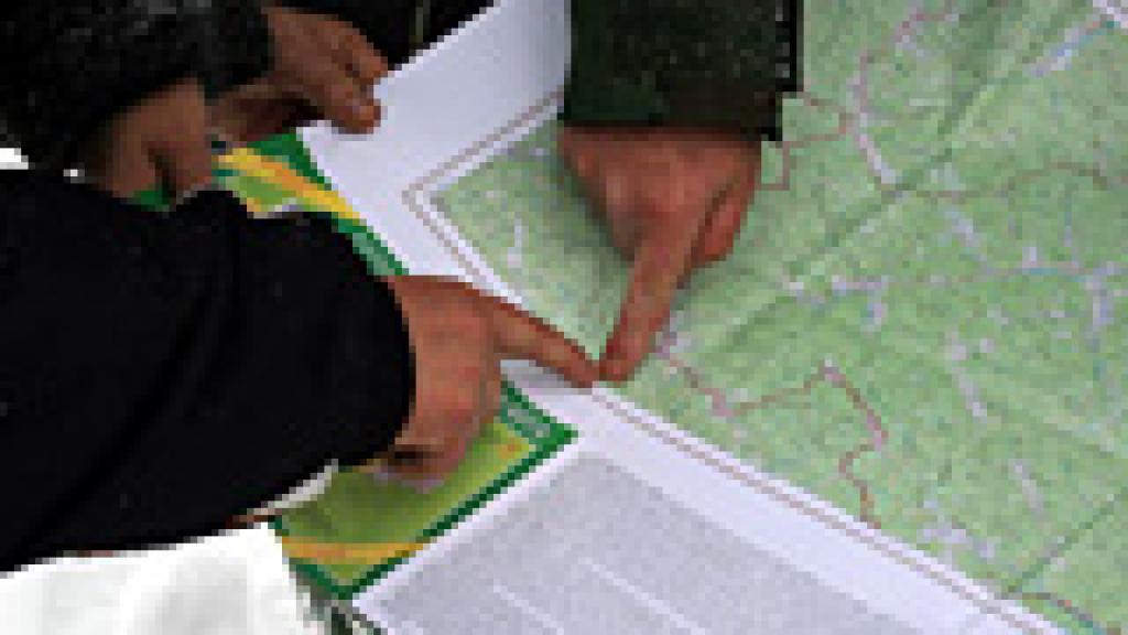 Hands pointing at a map 